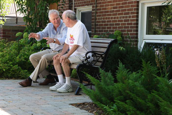 Hospice clients are those living with a progressive, life-threatening illness. Nick Ruiter (left) spends some time outside in a clients garden.